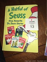 Front cover of A Hatful of Seuss hardcover book showing title, author, and images of five stories
