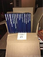15 Time Life books standing upright in a cardboard box, titles visible along the blue spine.