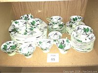Overall view of Shelley Chippendale Green dinnerware set including plates, bowls, cups, saucers