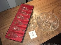 Full view of six boxed lead crystal wine glasses, large crystal bowl, and two punch bowl glasses
