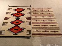 Both rugs laid flat on carpeted floor showing overall size and patterns