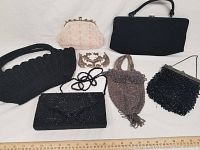 Overview of seven evening clutches and purses with varying styles and colors.