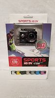 Front view of the sports camera in packaging showing clear waterproof housing and WiFi 1080p HD branding