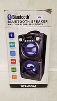 Photo of the Sylvania Bluetooth speaker box showing image and branding