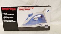 Photo shows the boxed Impress Compact & Lightweight Steam & Dry Iron model IM-102 with key features listed on the box.