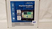 Box front of Magellan RoadMate 5635T-LM GPS showing key features and product image