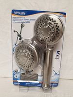 Original Aqua Plumb brand hand shower and shower head combo system packaging, showing the two shower heads with circular nozzle patterns.