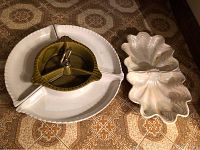Image showing both platters together; the white Lazy Susan base with green divided rotating tray in front and the shell-shaped platter to the right