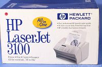 Box of HP LaserJet 3100 All-in-One Printer showing product branding and features including printing, fax, copier, and scanner functions.