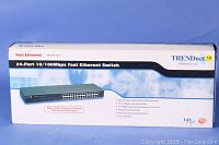 Original packaging box for TRENDnet 24-port 10/100Mbps Fast Ethernet Switch, showing product image and specifications.
