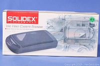Image of Solidex VHS rewinder in original box showing product name and model 938 on white and red packaging.