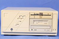 Front view of beige horizontal desktop PC showing dual floppy drives (5¼″ and 3½″), CD-ROM drive, power/HDD LEDs, turbo and lock switches, reset and power buttons