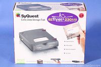 Photo of Syquest Ezflyer Superfast external hard drive boxed packaging showing branding and features.