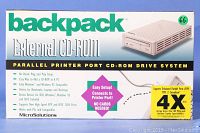 Front of product box showing brand 'backpack' and product title 'External CD-ROM' with details about parallel printer port interface and compatibility.