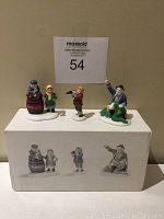 Three handpainted porcelain figurines displayed on top of the original box with printed images of the figurines on the front.