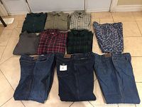 Overview of six men's XXL shirts laid out on floor, in colors green, beige, plaid, grey, red and green plaid.