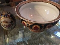Photo of the decorative egg and bowl together, showing size and design details.