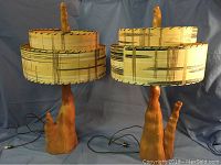Two vintage cypress knee lamps side by side showing sculptural wood bases and matching 1960s fabric shades