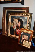 Photo of five wall art pieces stacked, showing the main signed original oil by Halbach of woman with white horse