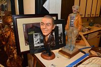 Shows the Frank Sinatra bobblehead statue, wooden clown statue with plaque, multiple framed photos including Rat Pack photos and signed Frank Sinatra photo