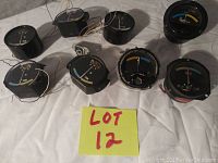 Top front view of 8 electronic panel meters and signal beacons with needle analog displays and wiring visible