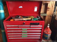 Mastercraft red steel tool chest open showing top storage compartment and overall chest