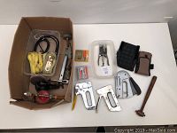 Full lot overview showing all tools including tie downs, staplers, drills, hammers, staples and organizer.