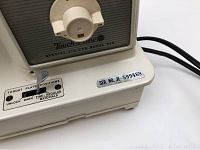 Close-up of the front base side showing model information 'Touch and Sew Special Zig-Zag Model 643' and serial number JE 599469, along with throat plate positions for materials.