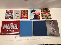 Top view of all 9 books arranged on a flat surface showing covers and sizes.