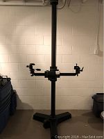 Front view of assembled tripod with horizontal arm and two heads