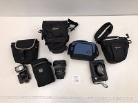 Full lot overview: Nikon SB-800 flash, Sigma 24-70 lens, four camera bags, Monaco Optix calibrator in Sinar case.