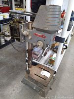 Side view of Beaver table top drill press showing motor, drill head and base setup