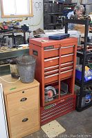 Front and side view of orange Benchmark 6-tier steel tool box