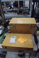 Two wooden storage boxes, one labeled gauge blocks and one labeled outside micrometer set