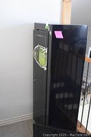 Front view of closed black steel security cabinet