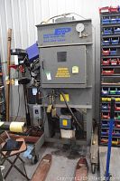 Full view of hydraulic press on casters with power unit and pressure gauge