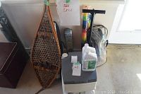 Full lot showing snowshoes, tent bag, snorkeling set, chemical toilet and bottles