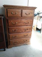 Front view of oak dresser showing two top drawers and four lower drawers