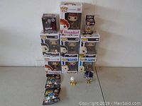 Overview of collectible figures arranged showing boxed and loose figures.