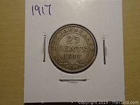 Obverse side of the 1917 Newfoundland 25 cents silver coin showing the denomination and year