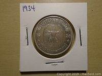 Obverse side of the 1934 Germany 5 Reichsmark silver coin showing German imperial eagle and denomination.