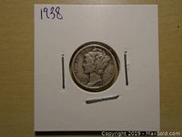 Front side of the 1938 Mercury Dime showing Liberty with winged cap enclosed in holder.