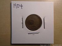 Obverse view of 1904 Indian Head penny coin with visible date and Indian Head profile.