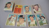 Stack and spread of vintage 1969 O Pee Chee baseball cards showing various players and teams including Royals, Expos, Phillies, White Sox, Athletics, and Twins.