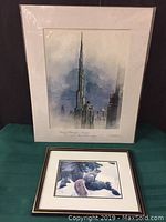 Front view showing both artworks, Dubai Burj Khalifa watercolor and the wildlife painting on green fabric