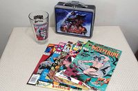 Full lot showing metal Empire Strikes Back lunch box, Marvel Wolverine glass, and four Wolverine comics.