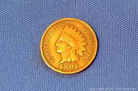 Front side of 1901 Indian Head One Cent coin showing Native American head with headdress and date