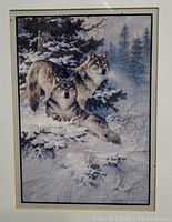 Close-up of the art print showing two wolves in a snowy forest setting, showcasing detail and color tone.