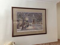 Overall framed and matted print hanging on wall