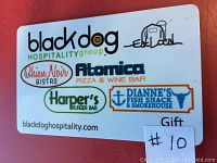 Photo of the Black Dog Hospitality Group $50 gift certificate showing restaurant logos and branding.